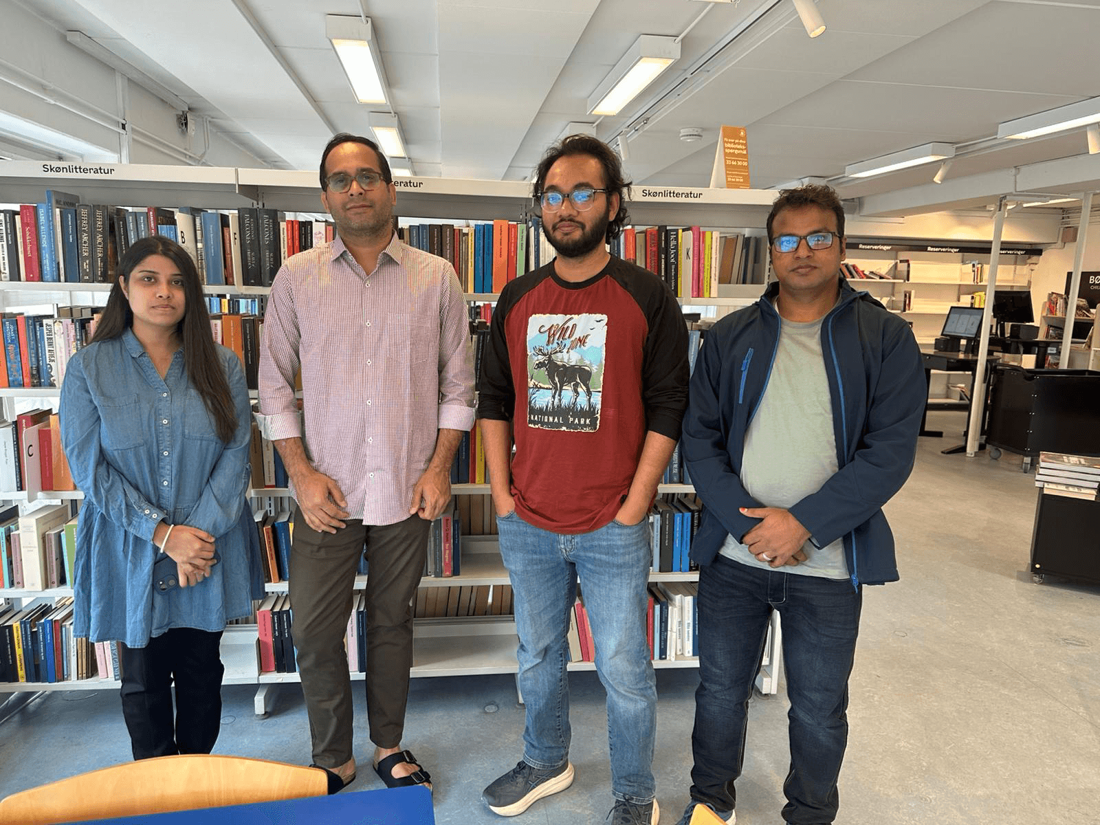 Volunteer Squad Denmark career workshop participants standing in a library